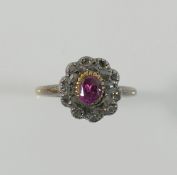 A 19th century diamond and garnet oval cluster ring, the central oval garnet set within a chip-cut