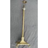 An early 20th century brass telescopic Corinthian column standard lamp, raised on square base with