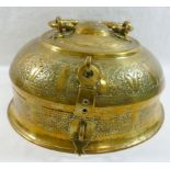 A 19th century Indian circular brass betel nut pandan box, with ornately embossed decoration and