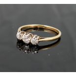 A diamond three-stone ring, the graduated old-cut stones approximately 0.15, 0.23 and 0.15 carats,