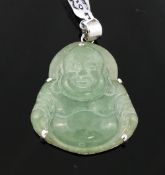 A selection of jade jewellery items comprised of a jade cylindrical bead necklace, a carved Buddha