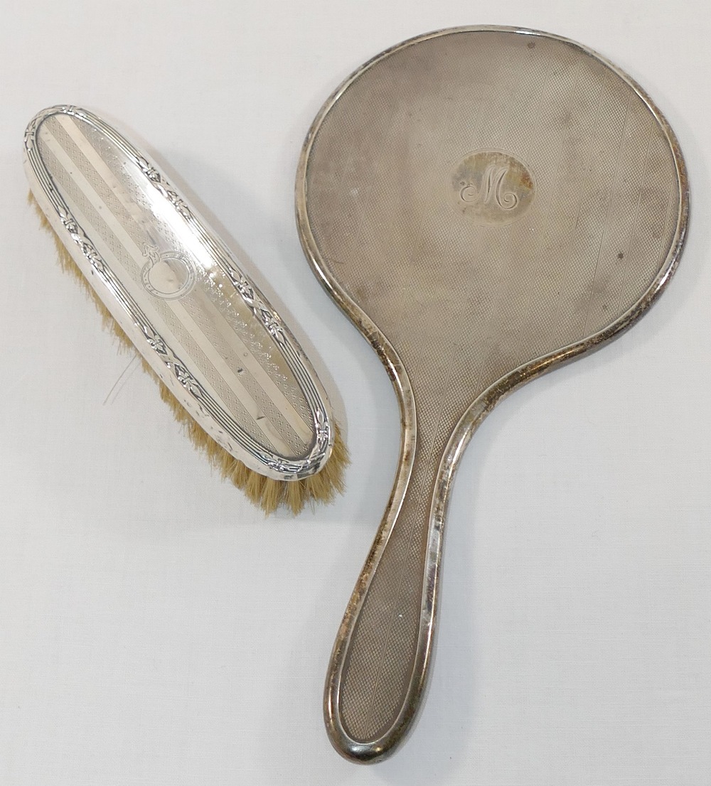 An ornate gilt spoon stamped 'sterling' by J Ritter, a small silver butter knife, a silver napkin