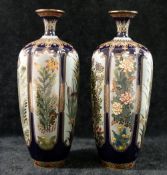 A pair of small Japanese Meiji period cloisonne vases, decorated with panels of flowers, unmarked,