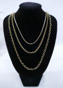 A tri-coloured chain stamped '10K', 61cm long, 2.7g, two 9 carat gold chains, 51cm and 61cm long,