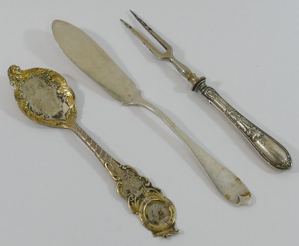 An ornate gilt spoon stamped 'sterling' by J Ritter, a small silver butter knife, a silver napkin - Image 2 of 6