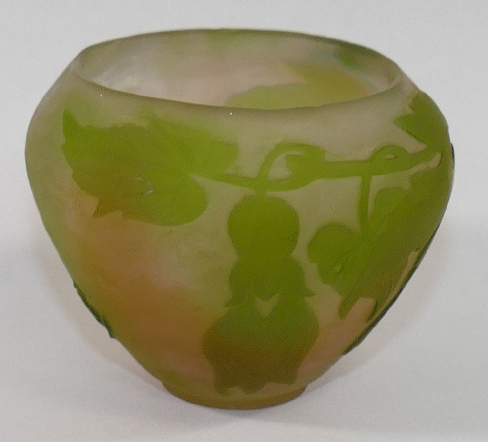 A small cameo glass bowl in the style of Galle decorated in relief with trailing flowers to a