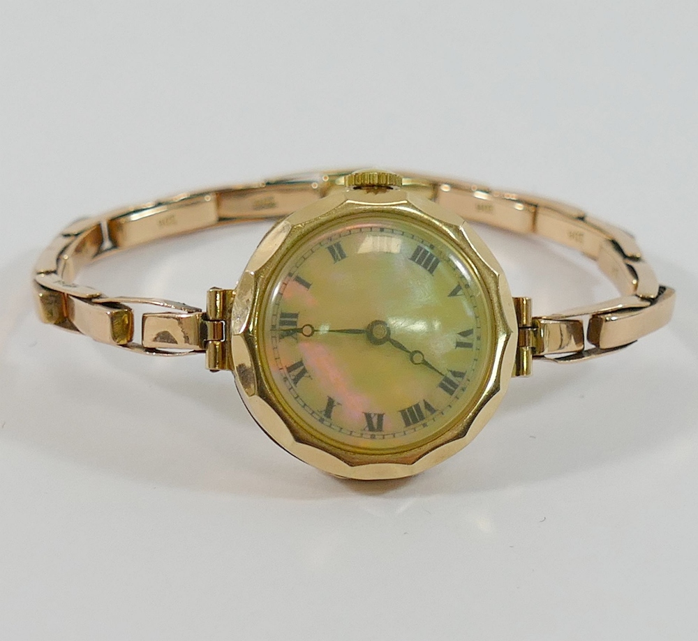 A 9 carat gold cased ladies bracelet watch, with expanding strap marked '9CT', 18.5g gross,