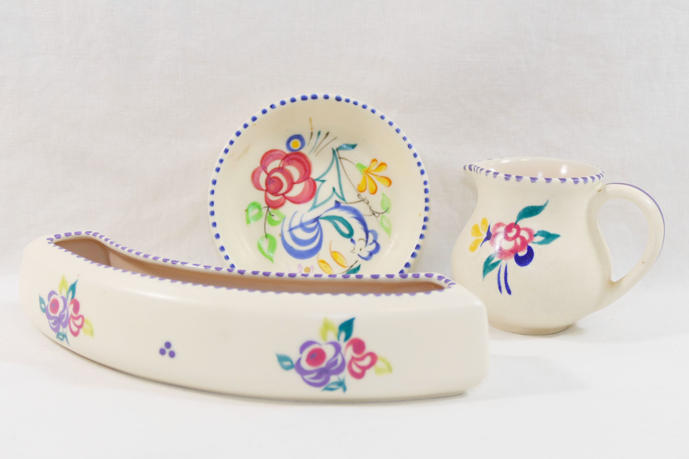 A collection of twelve items of mainly 1950's and later Poole Pottery, hand painted with flowers, - Image 2 of 5
