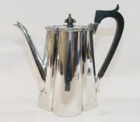 An Edwardian silver hot water jug, of tapered lobed form, by Walker and Hall, Sheffield 1907, with