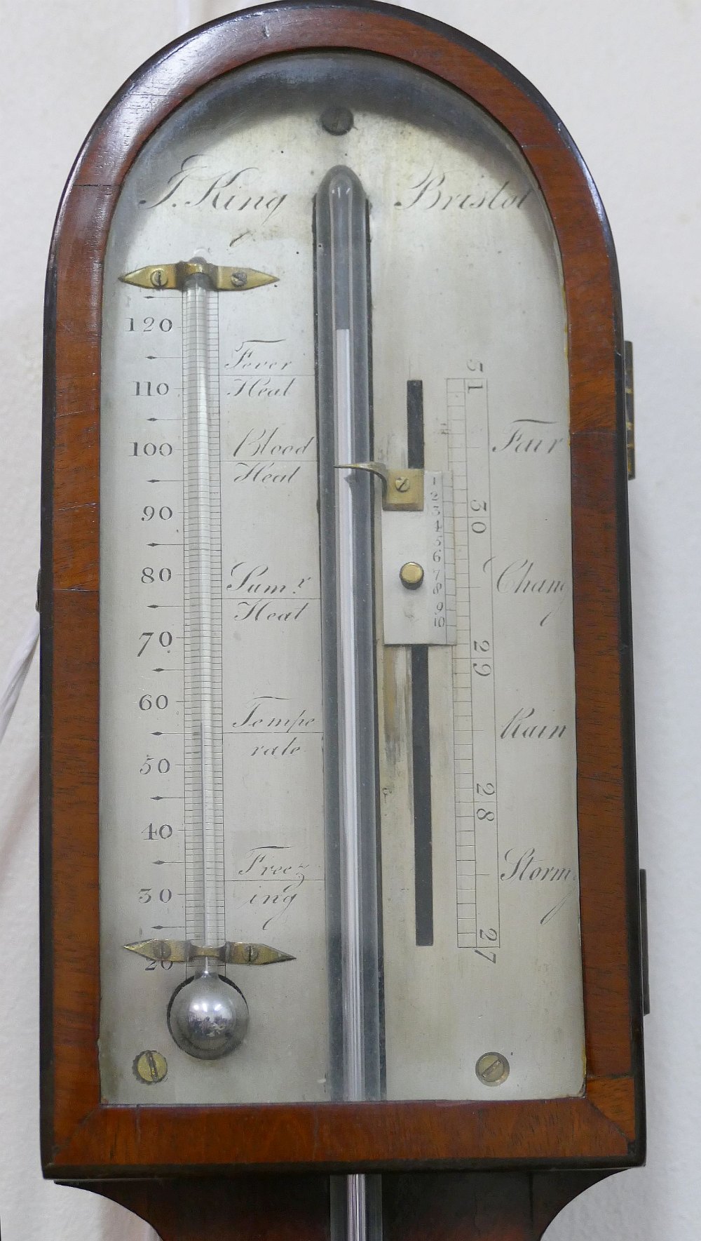 A 19th century mahogany stick barometer by J King of Bristol with silvered register plate and turned