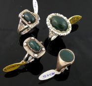 A bloodstone set panel ring stamped 'SIL', two other bloodstone set panel rings and a bloodstone set