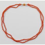 A Victorian double row coral necklace, the small oval beads each approximately 2.5mm diameter,