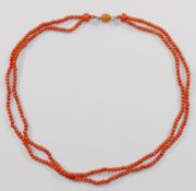 A Victorian double row coral necklace, the small oval beads each approximately 2.5mm diameter,