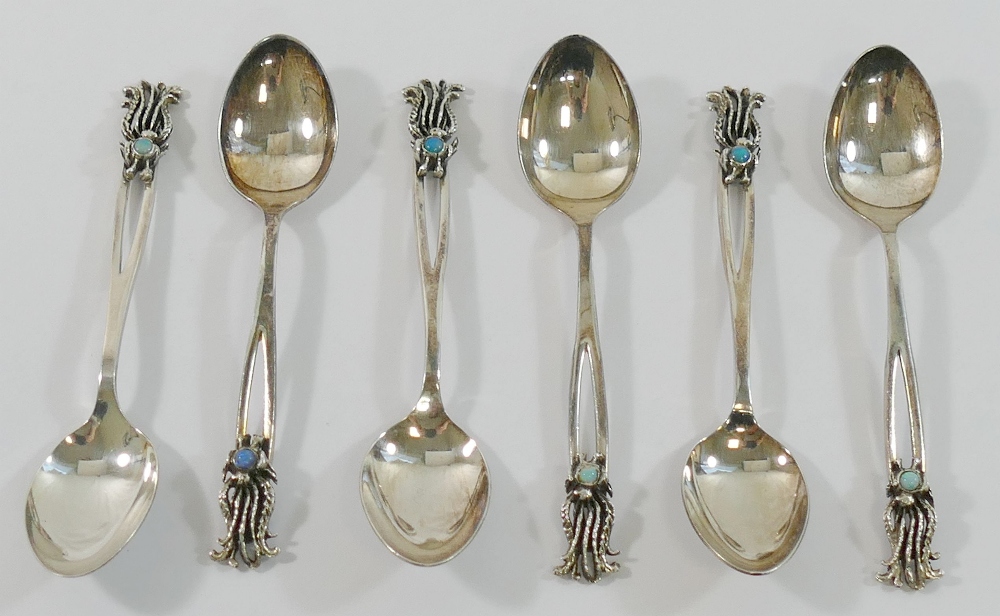 A set of six Australian coffee spoons with opal set terminals, by Dan Flynn, stamped 'STG SIL',