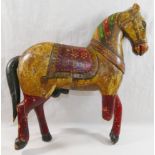 An Indo-Persian painted wooden horse, depicted in ceremonial trappings, 34cm longCONDITION REPORTS &