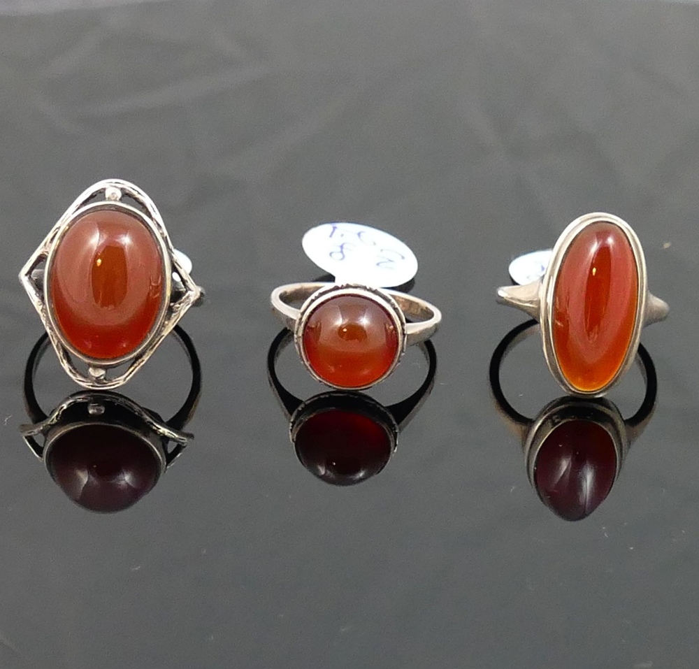 A selection of carnelian jewellery comprised of a circular openwork brooch, another brooch, a - Image 2 of 3