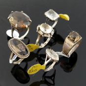 Twelve rock crystal and smokey quartz set rings, most stamped 'silver' or '925', including a