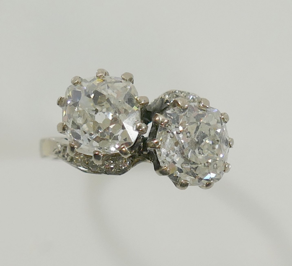 A diamond two-stone cross-over ring. the old-cut stones approximately 1.85 and 1.65 carats, I-J - Image 3 of 7