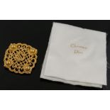 A small quantity of costume jewellery comprised of a large Christian Dior gold-plated brooch, 5.