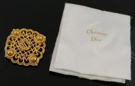 A small quantity of costume jewellery comprised of a large Christian Dior gold-plated brooch, 5.