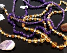 A collection of amethyst and citrine set  jewellery, the amethyst jewellery comprised a faceted bead