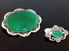 A selection of green agate jewellery comprised of a large oval brooch, 12cm wide, a smaller