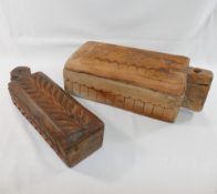 Two rectangular Indian carved wooden spice boxes with swivel lids, 26cm long and 31cm