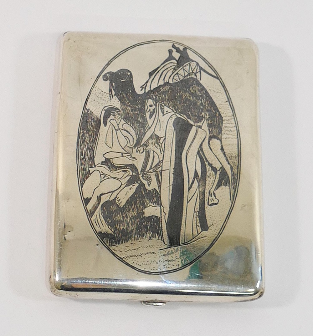 An Iraqi silver and niello cigarette case decorated with a camel and traders to one side and a - Image 2 of 2