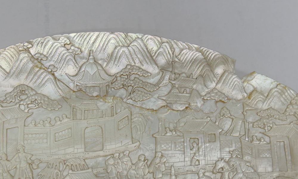 A large Chinese carved mother of pearl shell intricately decorated with a battle scene amongst - Image 6 of 7