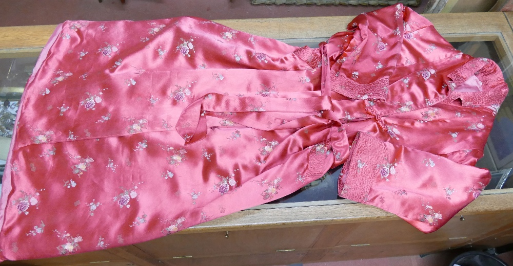 A vintage red satin ladies dressing gown with chinoiserie floral machine embroidered decoration, and - Image 3 of 4