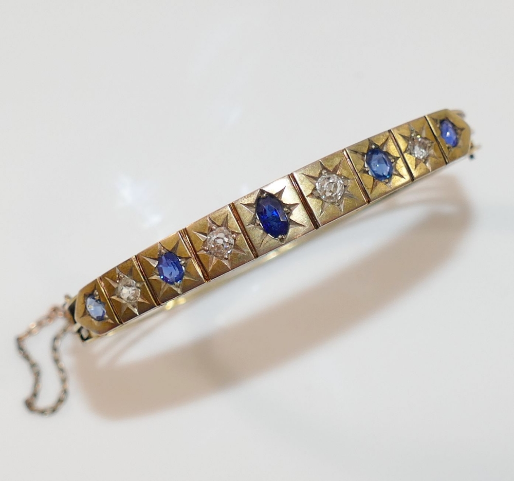 A late19th/early 20th century possibly French sapphire and diamond set hinged bangle, the four old- - Image 2 of 3