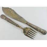 A pair of silver handled fish servers, a George III silver cruet stand, with turned wooden base,