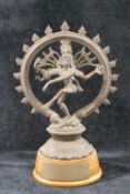 An Indian bronze figure of the Hindu god Shiva, raised on oval wooden plinth CONDITION REPORTS &