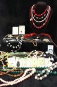 A paste set bracelet and a matched necklace, a black onyx pendant and a large selection of 20th