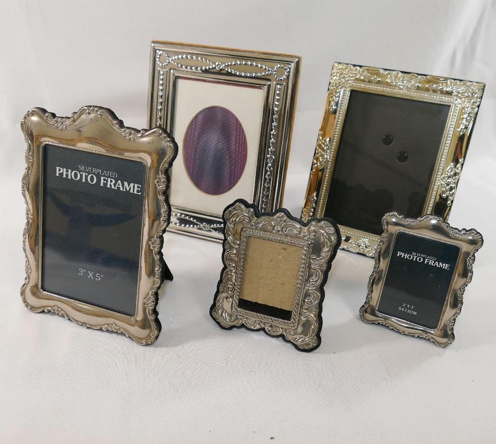 A silver plated photograph frame, with Neo Classical decoration, photo size 12.5cm x 8.5cm, and four