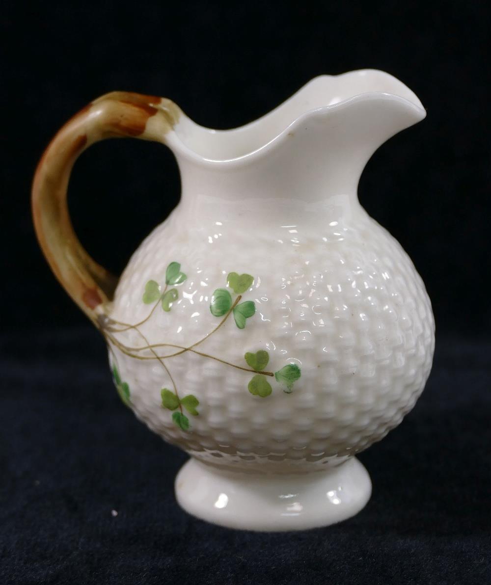 A Belleek second mark basket weave shamrock jug, 10cm high and German Belleek style semi-porcelain