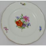 A set of four Meissen style porcelain soup plates, hand painted with floral sprays, with wavy gilt