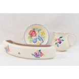A collection of twelve items of mainly 1950's and later Poole Pottery, hand painted with flowers,
