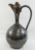 A Turkish Canakkale pottery brown glazed ewer, 32cm high, and another Turkish pottery yellow and