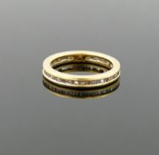 An 18 carat gold diamond eternity ring, the baguette cut diamonds combined weight 0.50 carats, in