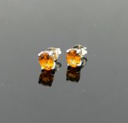 A pair of single stone oval mixed cut citrine stud earrings, the stones 7.8mm x 5.9mm, housed in