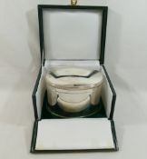 An oval silver biscuit box, Birmingham 1997 by Barker Ellis Silver Co., the domed hinged lid with