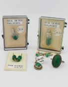 A selection of malachite jewellery comprised of two bead necklaces, a ring, three pendants, a pair