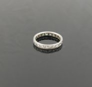 A platinum and diamond eternity ring, the 22 round brilliant cut diamonds each approximately 0.07