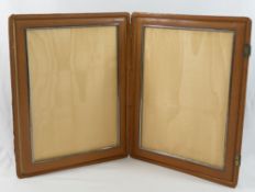 A vintage Cartier large folding pigskin leather double photograph frame, the clasps bearing French