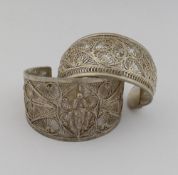Two Indian filigree cuff bracelets, a pair of Polish silver mounted clip on earrings, and assorted