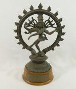 An Indian bronze figure of the Hindu god Shiva, raised on oval wooden plinth  CONDITION REPORTS &