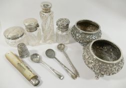 Three small cut glass silver topped scent bottles, the tallest 7cm, a small silver topped dressing