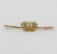 A late Victorian/Edwardian seed pearl set bar brooch, the plain bar set with central crown, the
