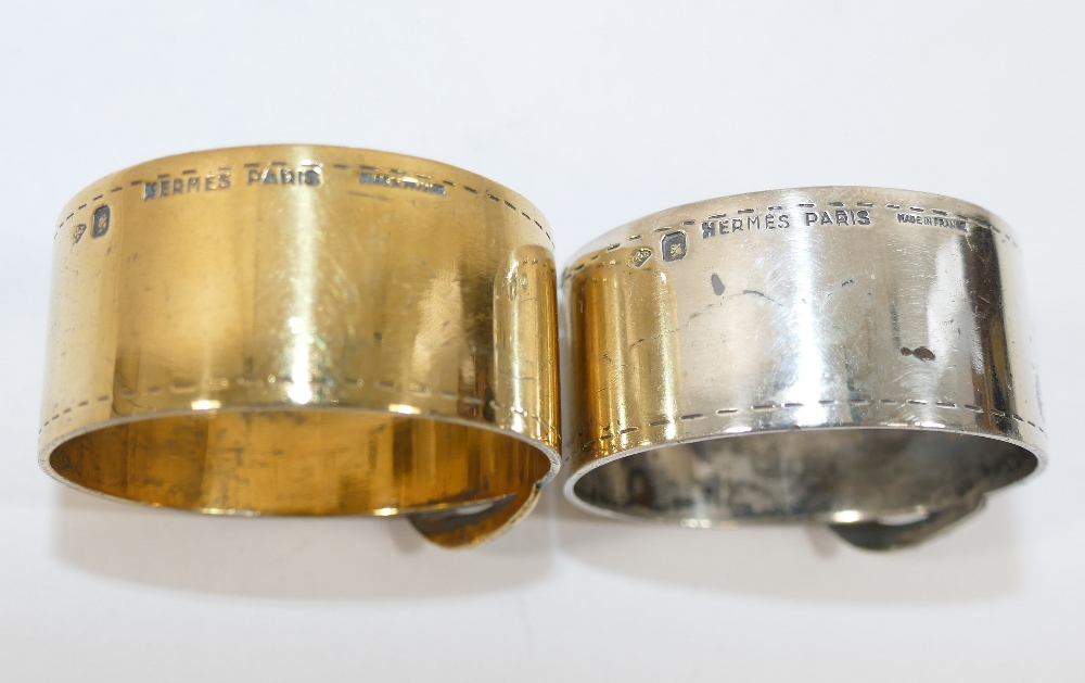 A Hermes of Paris gilded napkin ring in the form of a belt, and a matching non-gilded napkin ring, - Image 2 of 3